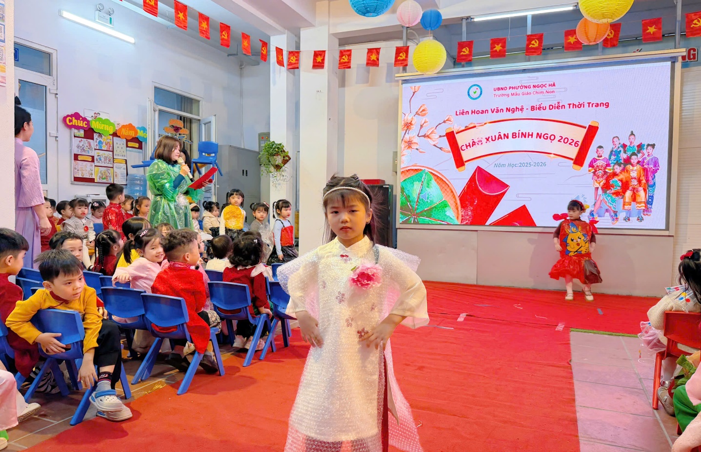 A child in a white dress in front of a group of children

AI-generated content may be incorrect.